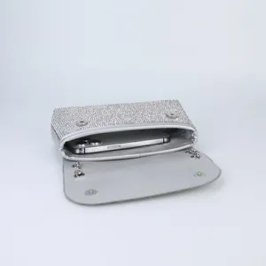 Exquisite silver rhinestone evening bag detail, stylish crossbody shoulder clutch for women.