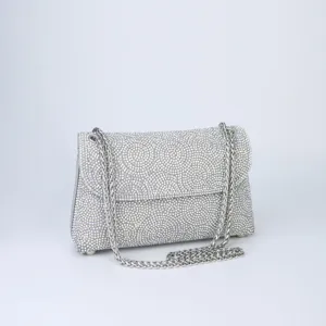Sparkling rhinestone evening bag detail, silver chain strap, elegant crystal flap shoulder bag.