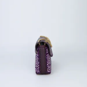 Purple rhinestone shoulder bag side view showing detailed profile with luxury gold chain.