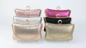 Close-up view of elegant rhinestone evening clutches featuring ring clasps and metal chain straps.