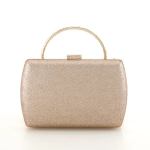 Sparkling gold evening clutch detail, featuring a sleek metallic ring handle and secure lock.