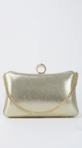 Gold evening clutch bag with metallic chain and rhinestone ring clasp for party dress.