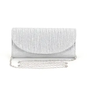 Silver glitter evening clutch bag detail, elegant chain strap accessory for weddings.