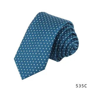 Blue and white polka dot necktie, rolled up classic design detail shot for men's fashion.