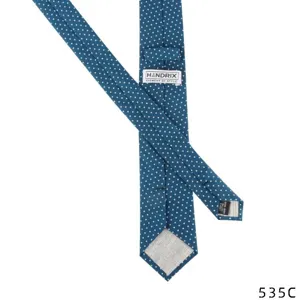 Blue and white polka dot linen cotton necktie, detailed back view showing handmade quality.