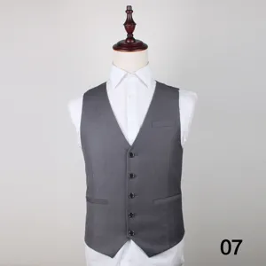 Men grey suit vest detail shot showing button closure, tailored fit, and elegant fabric texture.