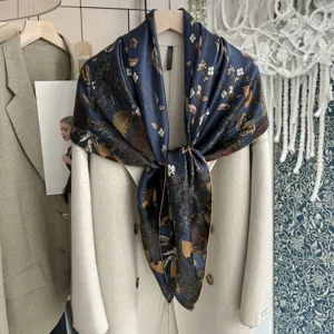 Silk scarf detail shot, elegant dark blue floral botanical print square scarf styled on coat.