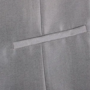 Grey suit vest detail fabric close-up, premium twill texture and fine stitching craftsmanship.