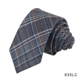 Men's casual plaid tie detail shot, showing the delicate texture and dark blue checked pattern.