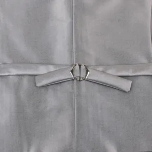 Grey suit vest back detail showcasing adjustable strap and metallic cinch buckle close-up.