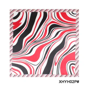 Detailed view of the women's square scarf with bold red and black abstract wave pattern.