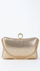 Gold rhinestone evening clutch bag detail showing sparkling crystals and metallic chain strap.