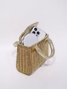 Exquisite gold rhinestone evening bag detail, sparkling crystal design with handle.