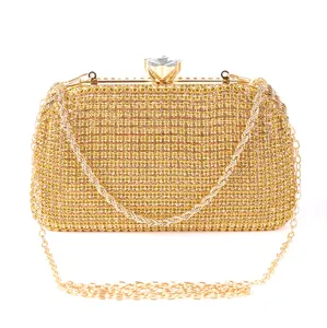 Exquisite gold rhinestone evening clutch bag detail, featuring dazzling crystals and a sturdy chain.