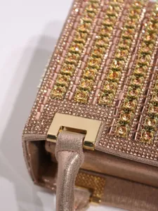 Sparkling rhinestone evening handbag luxury rose gold ladies clutch bag detail view.