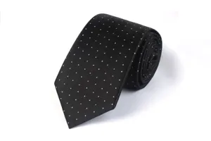 Close-up detail of a classic black necktie featuring elegant white polka dots for formal wear.