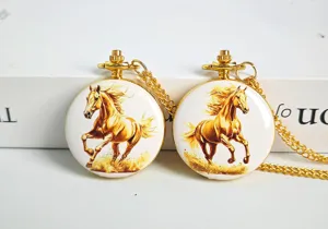 Detailed view of the gold-plated quartz pocket watch featuring a painted running horse motif.