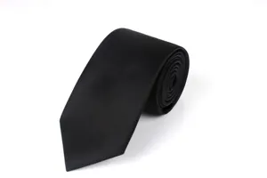 Detail shot of a classic black men tie, rolled neatly, perfect for formal business and suit wear.
