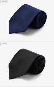 Close-up detail of premium men's silk ties in blue and black, featuring fine woven texture.