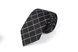 Detailed view of the elegant black rolled tie featuring sharp white and purple grid patterns.