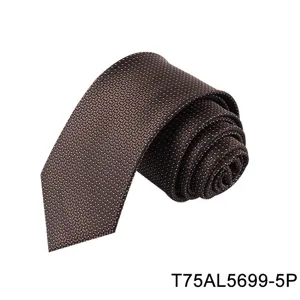 Close-up detail of brown geometric jacquard silk necktie showing fine texture and pattern.