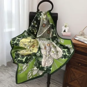 Luxurious green silk square scarf with elegant botanical floral print, soft smooth texture for women.
