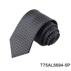 Detailed view of men's dark geometric jacquard tie, elegant pattern texture accessory.
