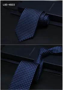 Detail view of men's silk jacquard tie in dark blue, perfect for business formal wear events.