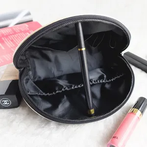 Bolso de maquillaje de viaje impermeable grande con soportes para lápiz labial y bolsillos.