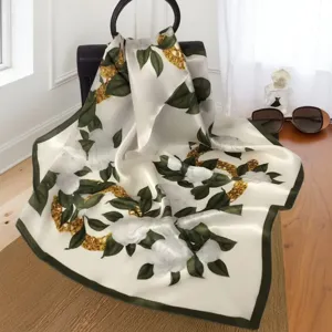 Luxurious silk large square scarf with elegant floral and chain print, smooth and soft.