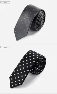 Detailed view of narrow men's ties with classic polka dot patterns and refined textures.