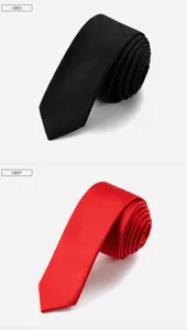 Close-up detail of slim men neckties, showing fabric texture and rolled display form.