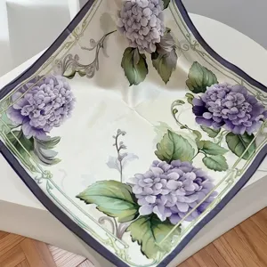Exquisite floral silk scarf detail showing purple hydrangea pattern and elegant draped texture.