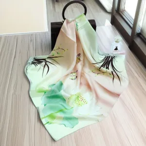 Exquisite silk scarf detail featuring elegant lotus and butterfly print design for women.
