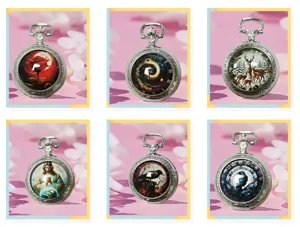 Detail view of vintage quartz pocket watches featuring various artistic glass cabochon patterns.