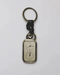 Portachiavi orologio da tasca al quarzo vintage con pelle e cassa in bronzo doppio display.