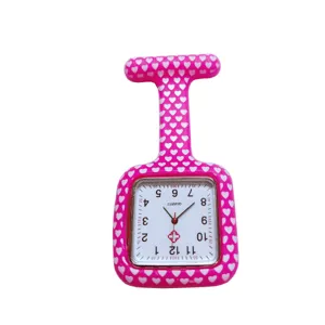 Pink silicone nurse fob watch detail, cute white heart pattern, quartz movement timepiece.