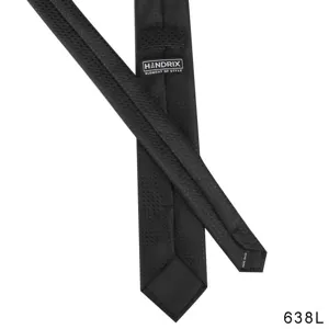 Black textured men's necktie detail shot with brand label and handmade craftsmanship.