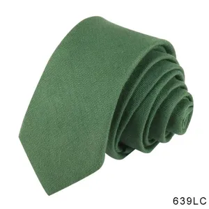 Men's solid green casual cotton linen tie detailed view showcasing textured fabric material.