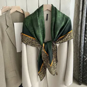 Exquisite silk square scarf featuring elegant green floral print and bold leopard border.