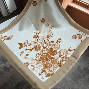 Detailed view of luxury silk square scarf with elegant vintage floral print and solid border.