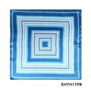 Blue geometric patterned silk square scarf for women, elegant fashion accessory detail view.