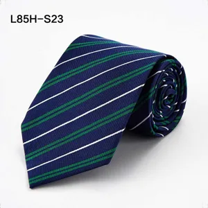 Detailed close-up of a classic navy blue men necktie featuring green and white diagonal stripes.