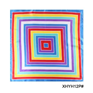 Close-up detail of geometric concentric square pattern silk scarf, vibrant colorful print.