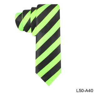 Close-up detail of stylish neon green and black striped narrow necktie fabric texture.