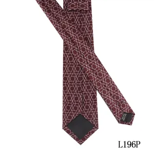 Detailed view of the dark red geometric patterned necktie showing fine fabric texture and neat fold.