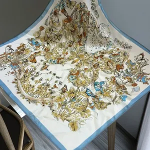 Luxury silk square scarf with vintage butterfly and floral print, elegant blue border accessory.