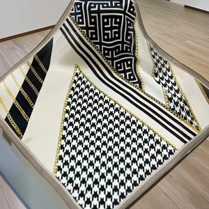Black and white geometric houndstooth silk square scarf with gold chain print, 55x55cm.