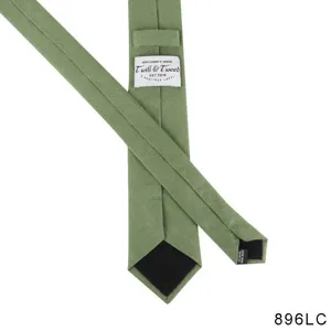 Close-up detail of men's solid green necktie back showing brand label and stitches.