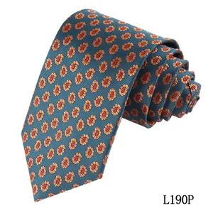 Detailed close-up view of men's blue-green vintage paisley and floral printed silk tie.